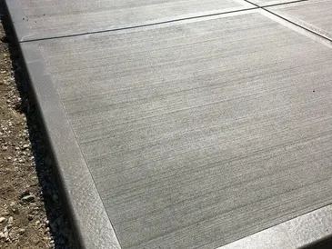 Broom-finish concrete surface with decorative border