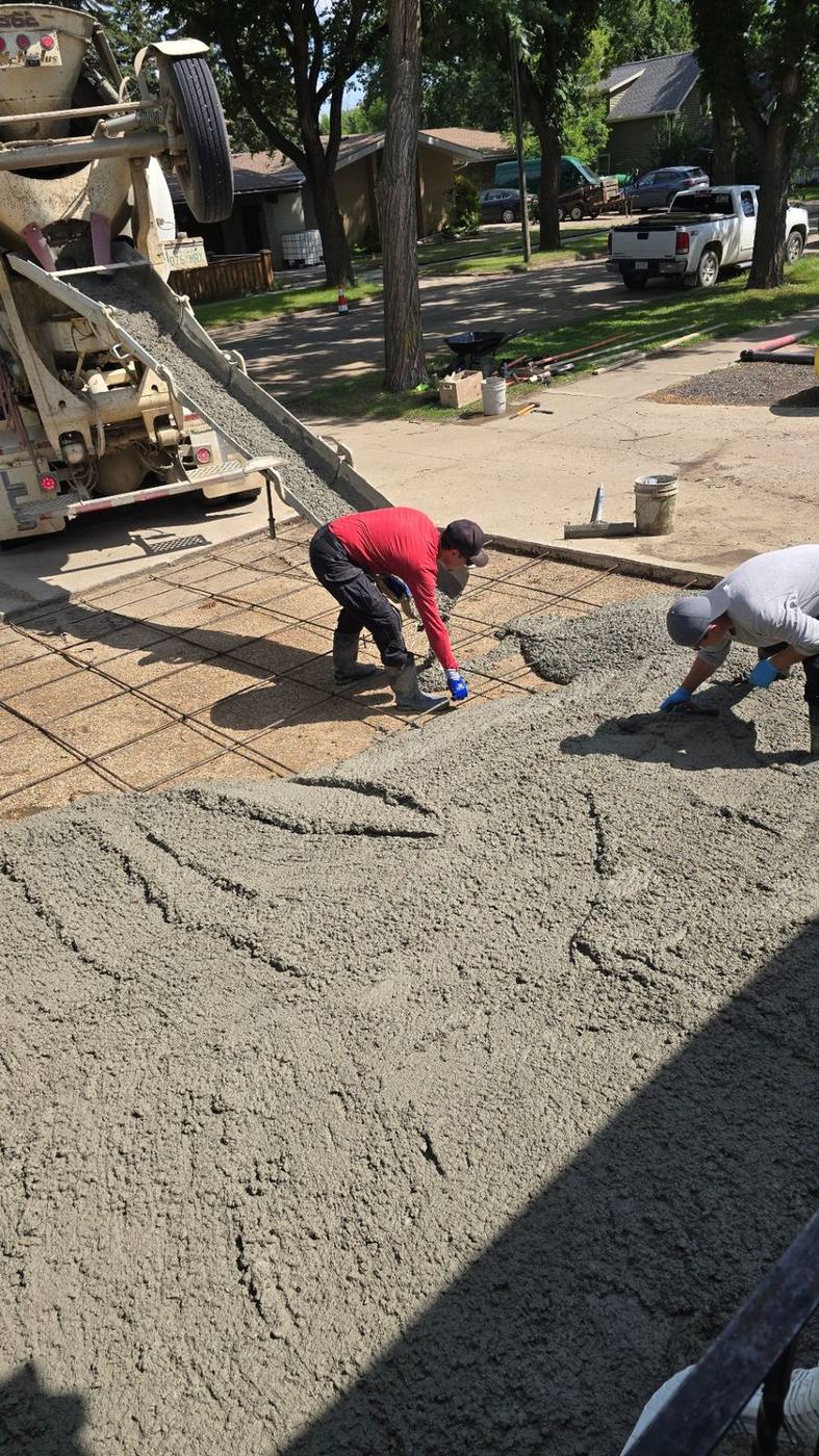 AB Concrete Finishing team floating and finishing a fresh concrete pour